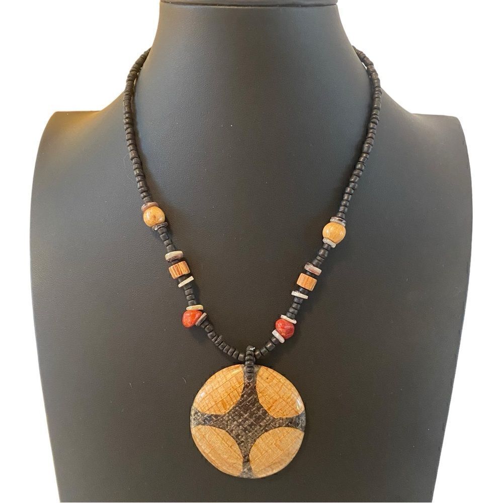 Tribal Looking Wood Pendant on Brown Beaded Chain.